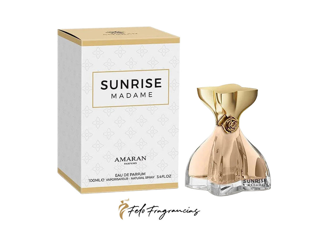 Caja y frasco de Eau de Parfum Sunrise Madame Amaran, con tapa dorada.