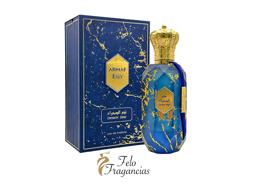 Blue Eau de Parfum bottle with gold crown cap and Desert Star boxed set
