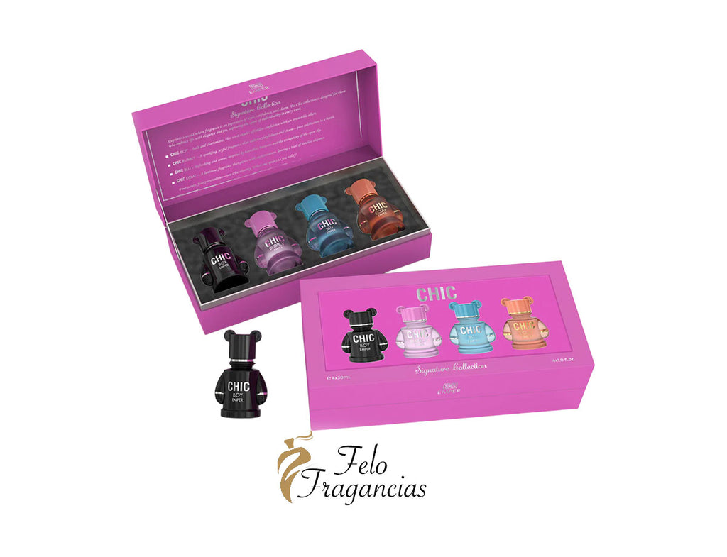 Estuche regalo rosa con 4 mini perfumes y frasco pequeño sobre fondo claro