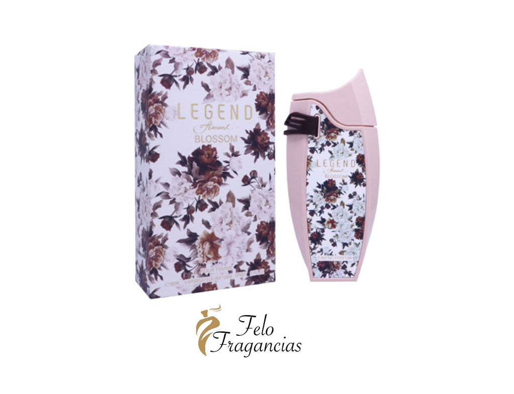 Caja y frasco de eau de parfum con flores moradas y fondo claro, tapa negra