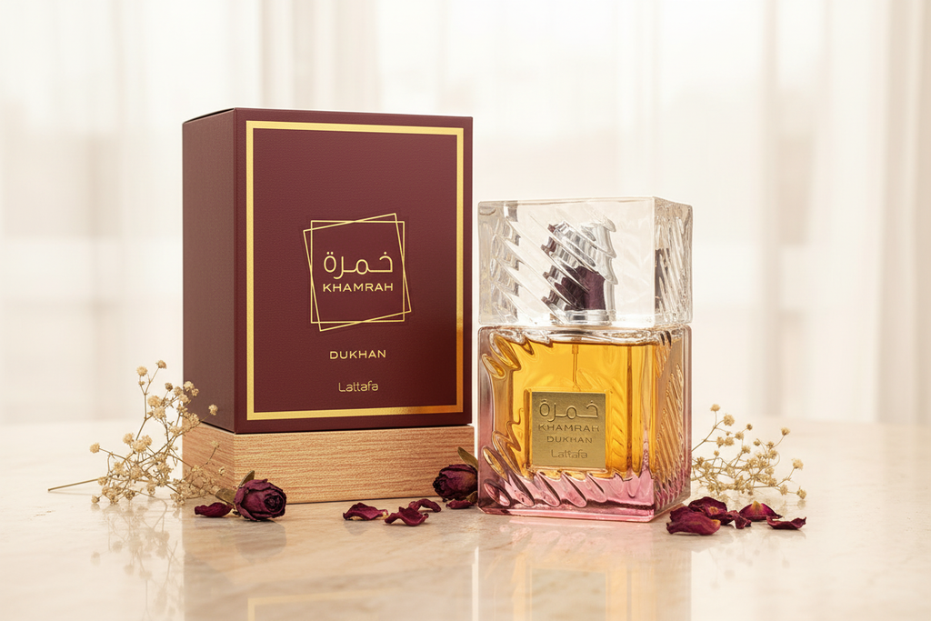 Perfume Lattafa Khamrah Dukhan en botella de vidrio con líquido ámbar y caja burdeos.