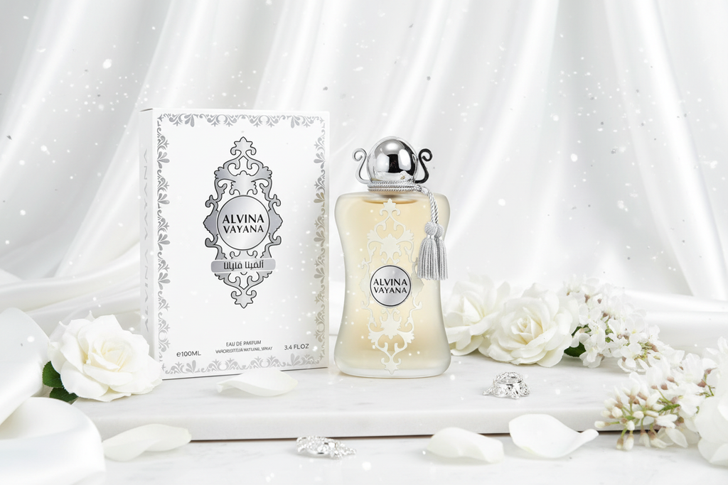 Perfume Alvina Vayana, botella de vidrio con tapa plateada y caja decorada.